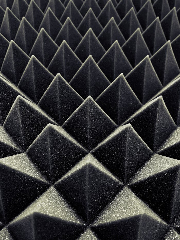 creative-03 Textured black acoustic foam panels create a striking geometric pattern.